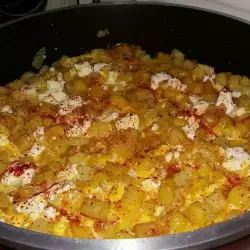 Fried Potatoes with Eggs and Feta Cheese