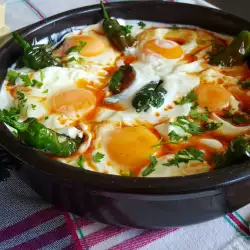 Spicy Chili Peppers with Eggs Sunny Side Up in Sauce