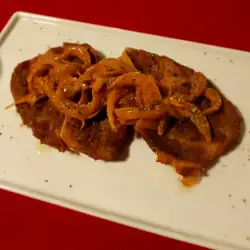 Oven-Baked Pork Neck Steaks with Onions