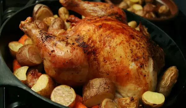 Chicken Stuffed with Rice and Garnished with Potatoes