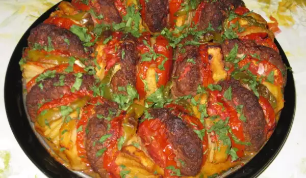 Meatballs with Potatoes and Tomatoes in the Oven
