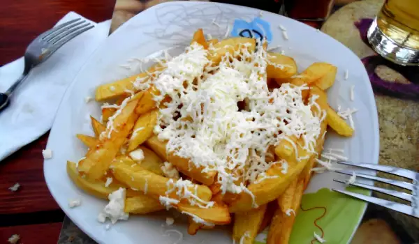 French Fries Cooked in Butter and with Feta Cheese on Top