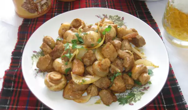 Pork Bits with Mushrooms and Onions in a Pan